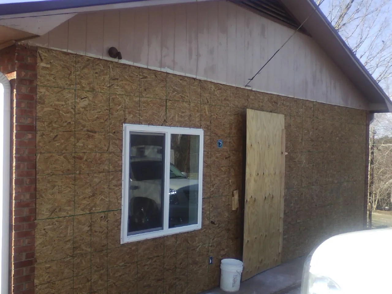 OSB sheathing on a garage addition wall before siding in San Pedro